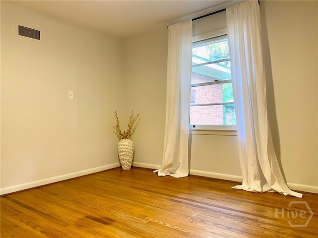 5524 Reynolds St, Savannah, GA 31405 - empty room with baseboards, wood finished floors, and plenty of natural light