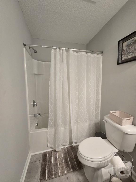 269 Brightleaf Cir, Hinesville, GA 31313 - bathroom with a textured ceiling, toilet, shower / bath combo, baseboards, and tile patterned flooring