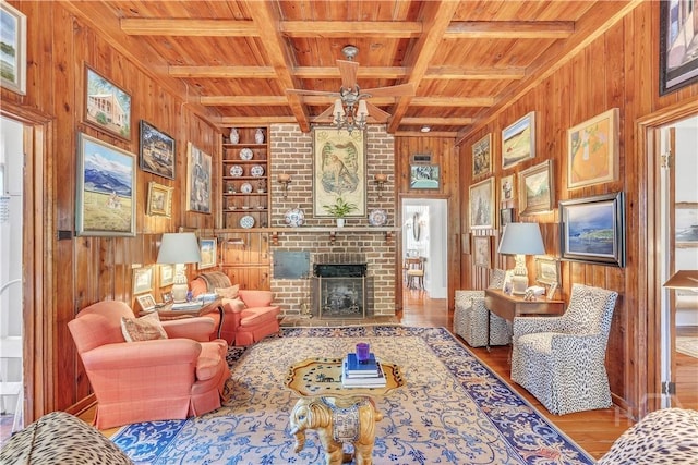905 Goebel Ave, Savannah, GA 31404 - living area featuring wood walls, wooden ceiling with exposed beams, wood finished floors, a ceiling fan, and built in shelves