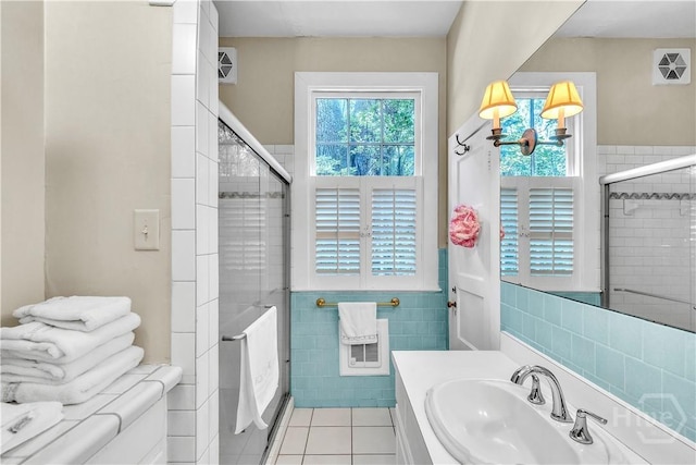 905 Goebel Ave, Savannah, GA 31404 - full bath featuring tile walls, a shower stall, vanity, and tile patterned floors