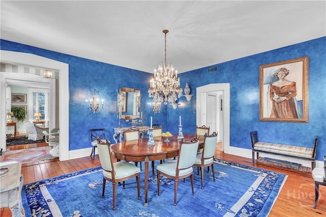 905 Goebel Ave, Savannah, GA 31404 - dining area featuring wood-type flooring, a chandelier, and baseboards