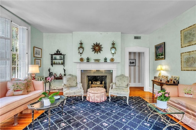 905 Goebel Ave, Savannah, GA 31404 - living area featuring wood finished floors, a fireplace, and baseboards