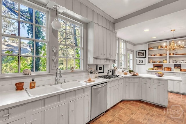 905 Goebel Ave, Savannah, GA 31404 - kitchen featuring stainless steel appliances, crown molding, a sink, and light countertops