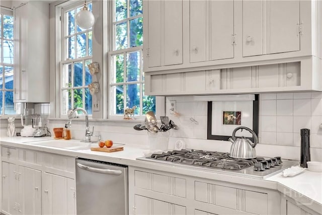 905 Goebel Ave, Savannah, GA 31404 - kitchen featuring stainless steel appliances, a sink, light countertops, and backsplash