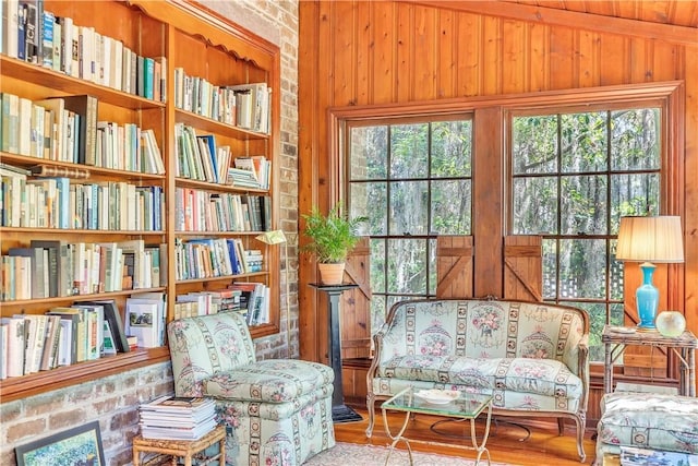 905 Goebel Ave, Savannah, GA 31404 - living area with wood walls, vaulted ceiling, and wood finished floors