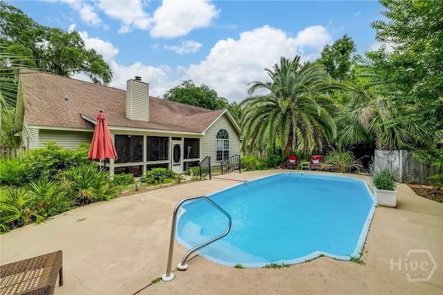 24 Mary Musgrove Dr, Savannah, GA 31410 - view of swimming pool with a sunroom and a patio