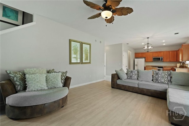 130 Willow Point Cir, Savannah, GA 31407 - living area with baseboards, a ceiling fan, light wood finished floors, a chandelier, and recessed lighting