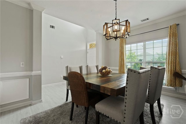 130 Willow Point Cir, Savannah, GA 31407 - dining room featuring a chandelier, light wood-style flooring, ornamental molding, and baseboards
