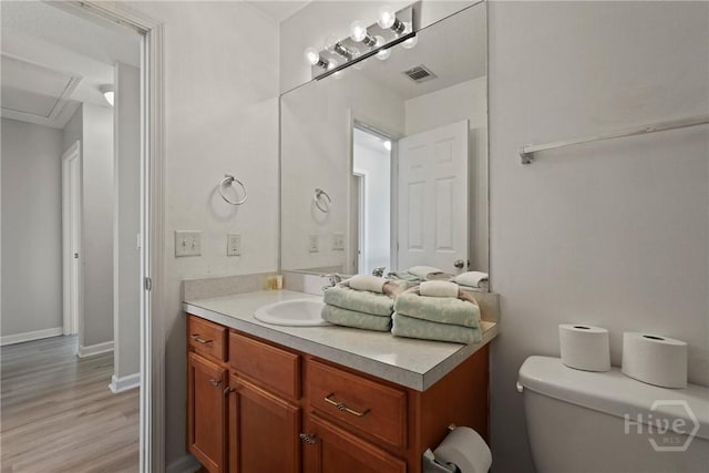130 Willow Point Cir, Savannah, GA 31407 - half bathroom with vanity, toilet, wood finished floors, and baseboards