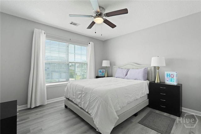 130 Willow Point Cir, Savannah, GA 31407 - bedroom with baseboards, light wood-type flooring, and a ceiling fan