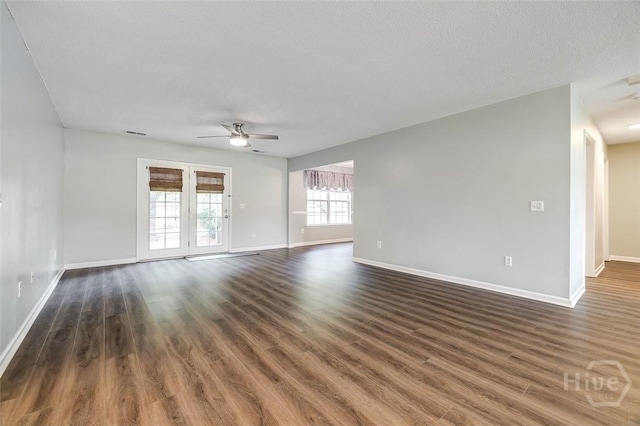 131 Warner Dr, Guyton, GA 31312 - spare room featuring ceiling fan, baseboards, dark wood finished floors, and a textured ceiling