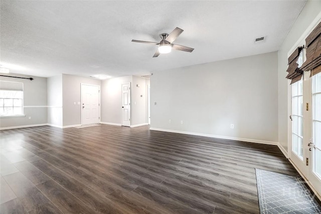 131 Warner Dr, Guyton, GA 31312 - unfurnished living room featuring baseboards, healthy amount of natural light, dark wood-style floors, and ceiling fan