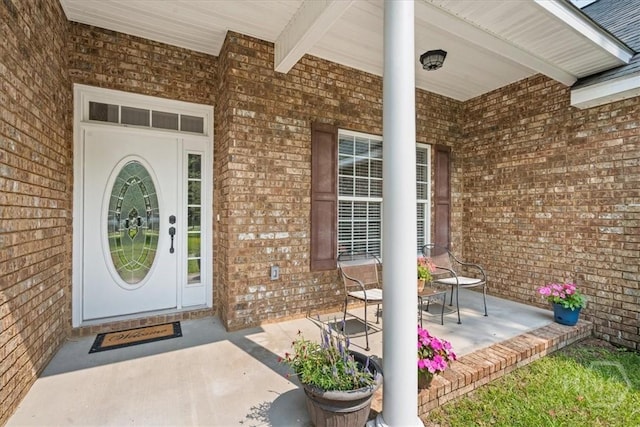 190 Sandpiper Dr, Midway, GA 31320 - view of exterior entry featuring brick siding and a porch