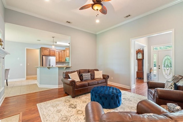 190 Sandpiper Dr, Midway, GA 31320 - living room featuring a ceiling fan, light wood finished floors, ornamental molding, baseboards, and recessed lighting
