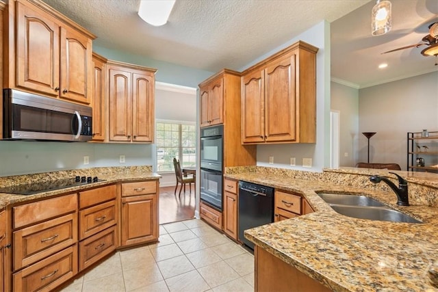 190 Sandpiper Dr, Midway, GA 31320 - kitchen with black appliances, a sink, light stone countertops, a ceiling fan, and light tile patterned floors