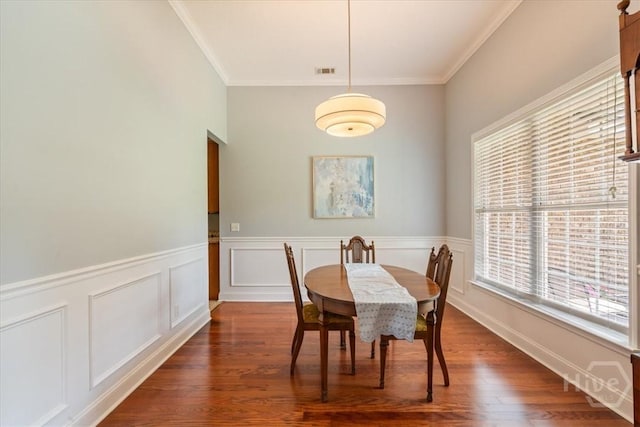 190 Sandpiper Dr, Midway, GA 31320 - dining area with ornamental molding, a wainscoted wall, and wood finished floors