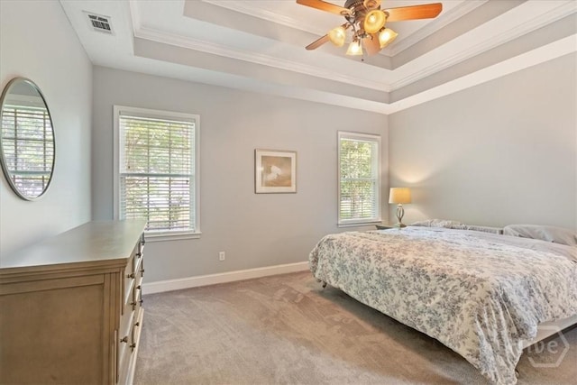 190 Sandpiper Dr, Midway, GA 31320 - bedroom featuring light carpet, multiple windows, crown molding, and a tray ceiling
