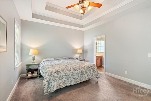 190 Sandpiper Dr, Midway, GA 31320 - bedroom featuring crown molding, carpet, baseboards, a raised ceiling, and connected bathroom