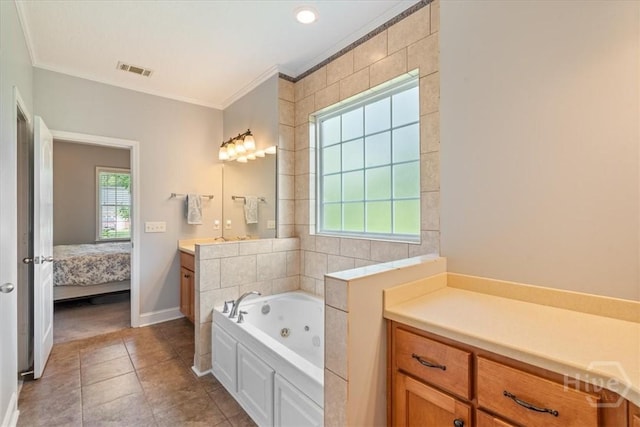 190 Sandpiper Dr, Midway, GA 31320 - ensuite bathroom featuring vanity, a tub with jets, ornamental molding, tile patterned floors, and baseboards