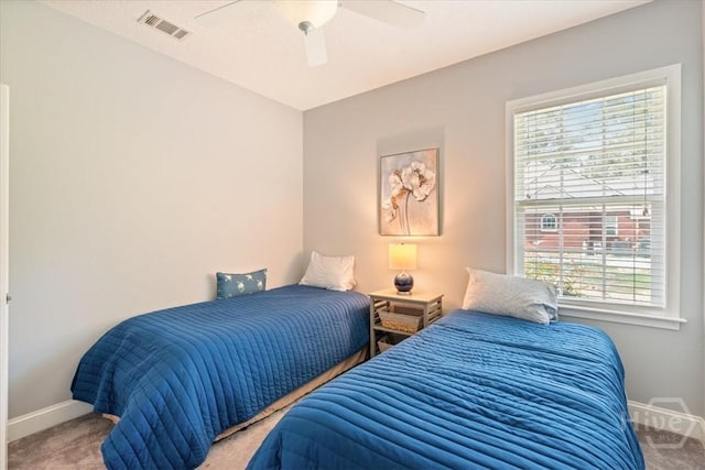 190 Sandpiper Dr, Midway, GA 31320 - bedroom with carpet floors, baseboards, and a ceiling fan