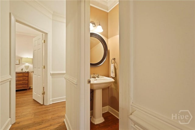 118 Woodline Dr, Savannah, GA 31410 - half bath with wood finished floors, crown molding, baseboards, and a sink