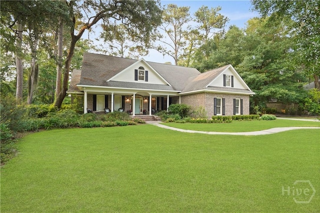 118 Woodline Dr, Savannah, GA 31410 - view of front of home featuring covered porch, a front yard, and brick siding