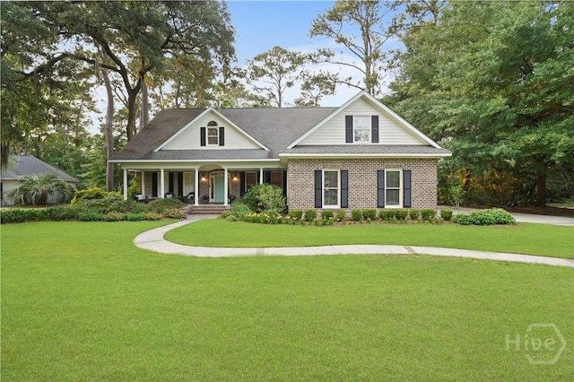 118 Woodline Dr, Savannah, GA 31410 - view of front of property featuring covered porch, a front yard, and brick siding