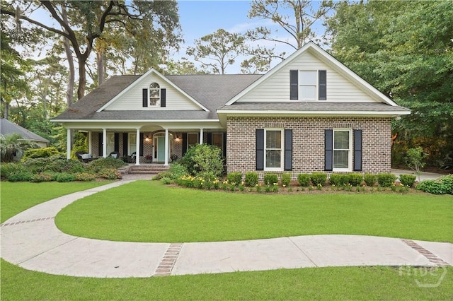 118 Woodline Dr, Savannah, GA 31410 - view of front facade featuring covered porch, brick siding, a front lawn, and a shingled roof