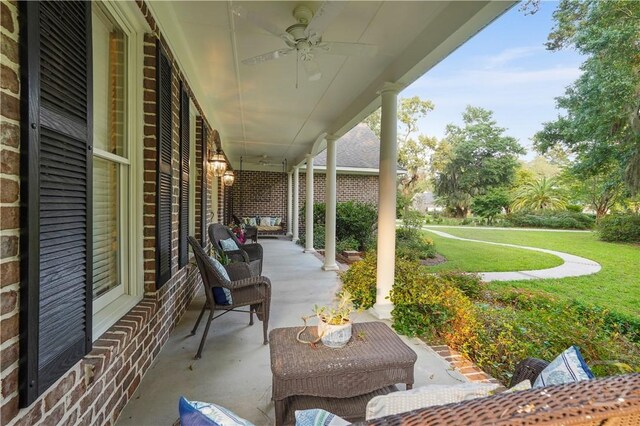 118 Woodline Dr, Savannah, GA 31410 - porch featuring a ceiling fan and a lawn