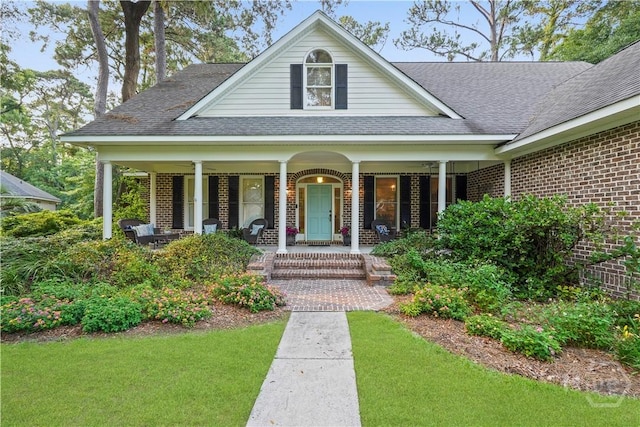 118 Woodline Dr, Savannah, GA 31410 - view of front of home featuring brick siding, roof with shingles, covered porch, and a front yard