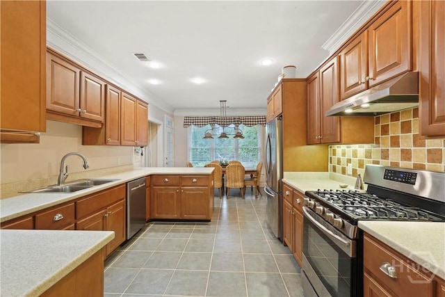 118 Woodline Dr, Savannah, GA 31410 - kitchen with appliances with stainless steel finishes, under cabinet range hood, a sink, light tile patterned floors, and light countertops