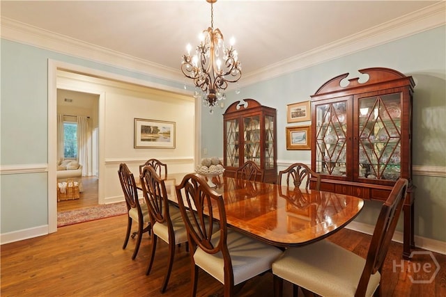 118 Woodline Dr, Savannah, GA 31410 - dining area with a chandelier, wood finished floors, and ornamental molding