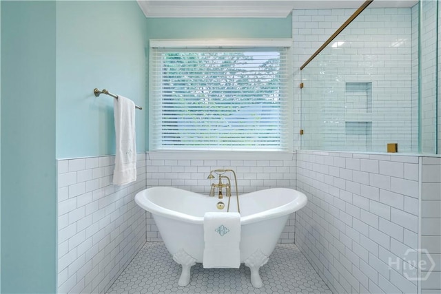 118 Woodline Dr, Savannah, GA 31410 - full bath featuring tile walls, a freestanding bath, crown molding, tile patterned floors, and a wainscoted wall