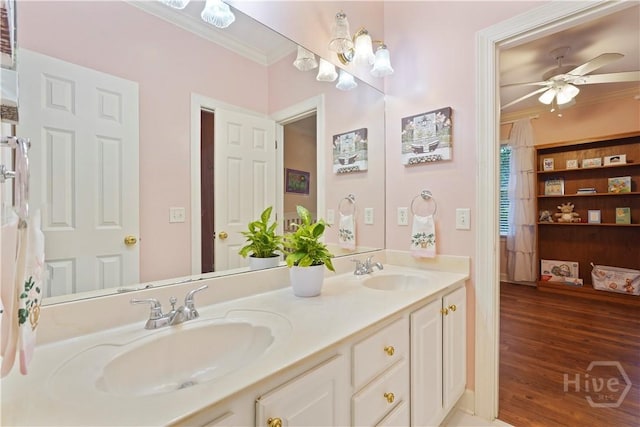 118 Woodline Dr, Savannah, GA 31410 - bathroom with ornamental molding, double vanity, a ceiling fan, and wood finished floors