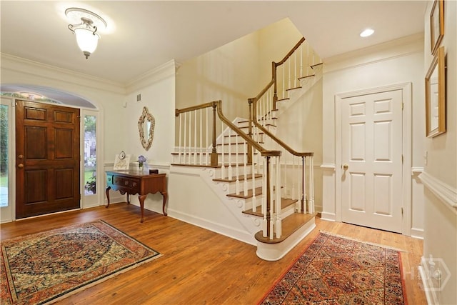 118 Woodline Dr, Savannah, GA 31410 - foyer featuring crown molding, wood finished floors, stairs, and arched walkways