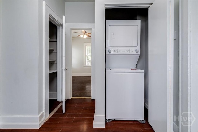 810 34th St, Savannah, GA 31401 - washroom with stacked washer and clothes dryer, dark wood-type flooring, and baseboards