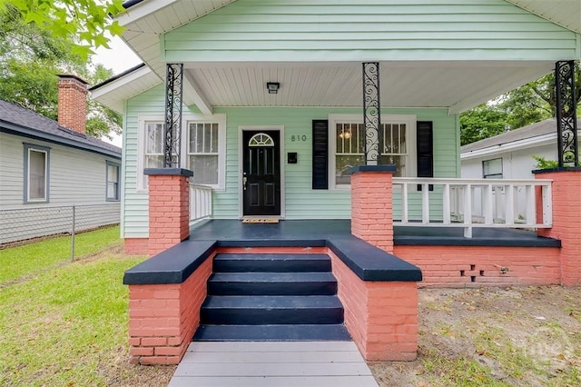 810 34th St, Savannah, GA 31401 - doorway to property featuring a porch