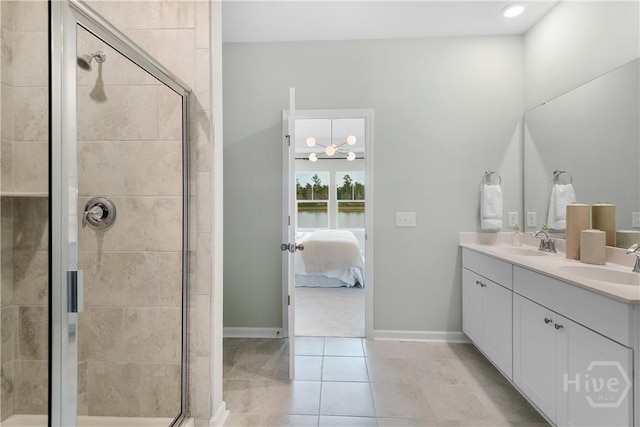 797 Blue Moon Xing, Pooler, GA 31322 - ensuite bathroom featuring double vanity, a stall shower, tile patterned floors, and baseboards