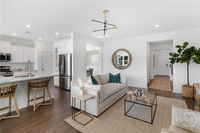 797 Blue Moon Xing, Pooler, GA 31322 - living room with dark wood-style flooring, recessed lighting, a chandelier, and baseboards