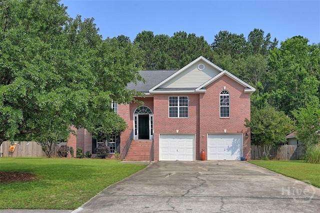 207 Pink Dogwood Ln, Pooler, GA 31322 - view of front of property with an attached garage, driveway, and brick siding