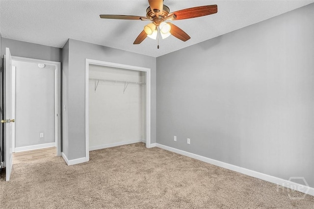 207 Pink Dogwood Ln, Pooler, GA 31322 - unfurnished bedroom with carpet flooring, a closet, baseboards, ceiling fan, and a textured ceiling