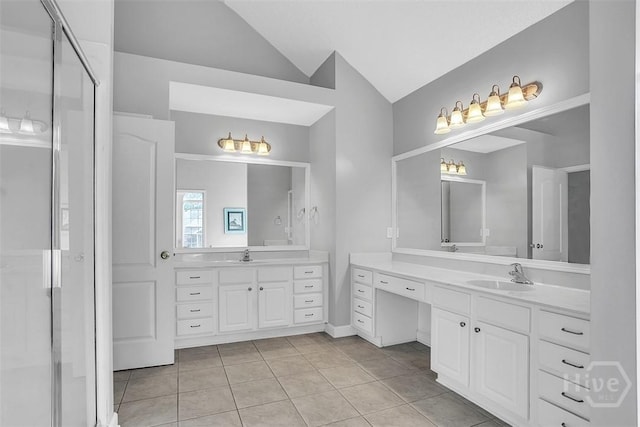 207 Pink Dogwood Ln, Pooler, GA 31322 - bathroom featuring two vanities, tile patterned flooring, vaulted ceiling, and a stall shower