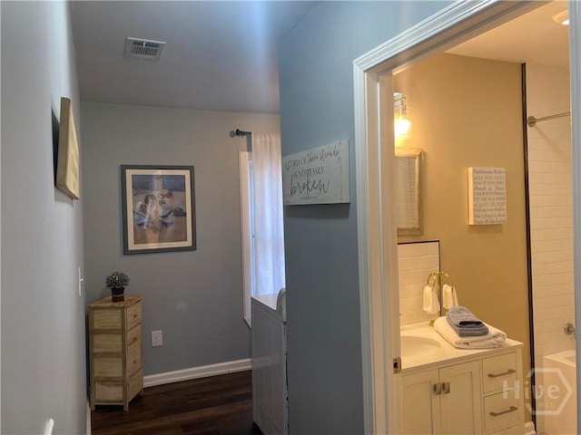 4114 Old Louisville Rd, Garden City, GA 31408 - hallway with dark wood-style flooring and baseboards