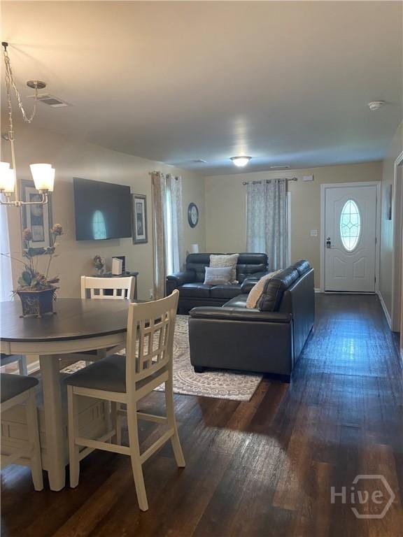 4114 Old Louisville Rd, Garden City, GA 31408 - living area with dark wood finished floors and a chandelier