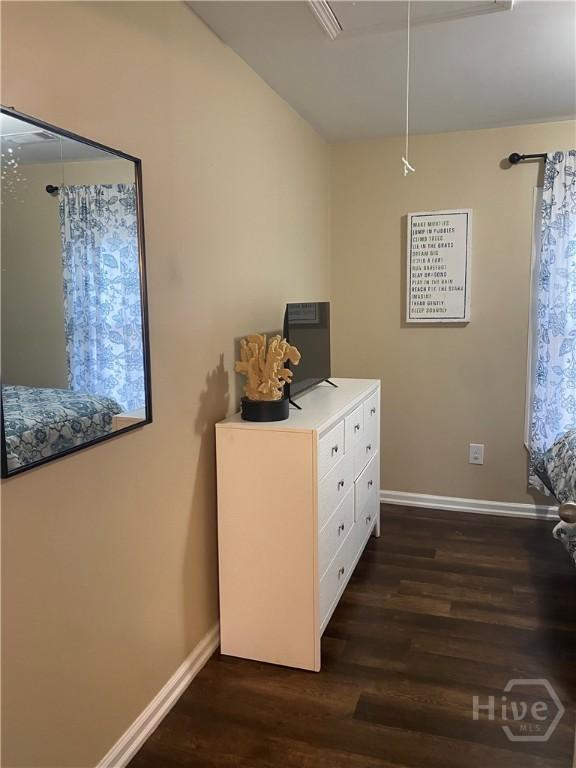 4114 Old Louisville Rd, Garden City, GA 31408 - bedroom featuring dark wood-style floors, baseboards, and attic access