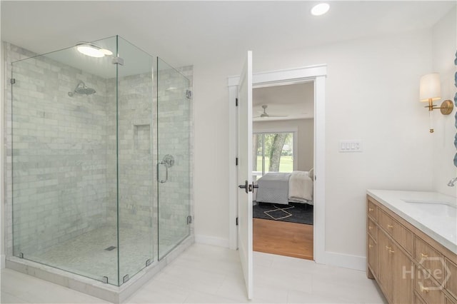 6 Schroeder Ct, Savannah, GA 31411 - ensuite bathroom featuring ceiling fan, vanity, a stall shower, baseboards, and recessed lighting