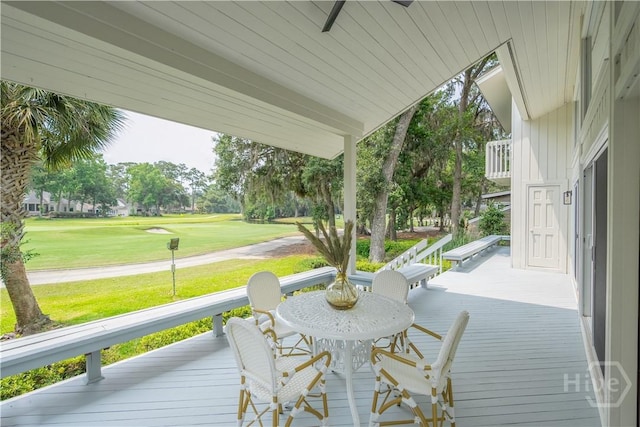 6 Schroeder Ct, Savannah, GA 31411 - wooden deck with ceiling fan, view of golf course, and a lawn