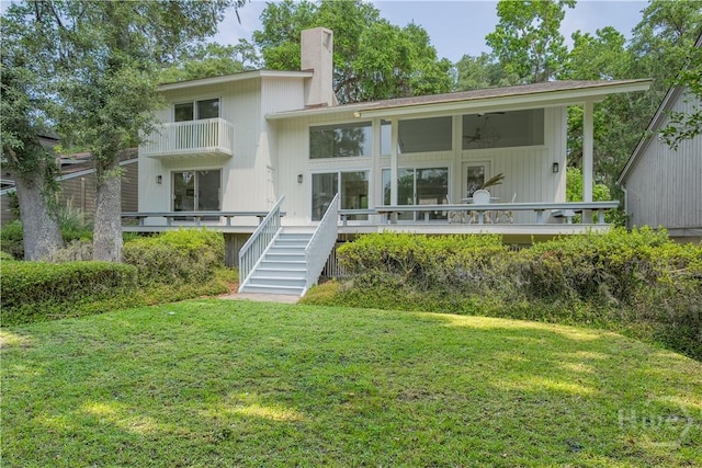 6 Schroeder Ct, Savannah, GA 31411 - rear view of property featuring a yard, a chimney, a wooden deck, stairs, and ceiling fan