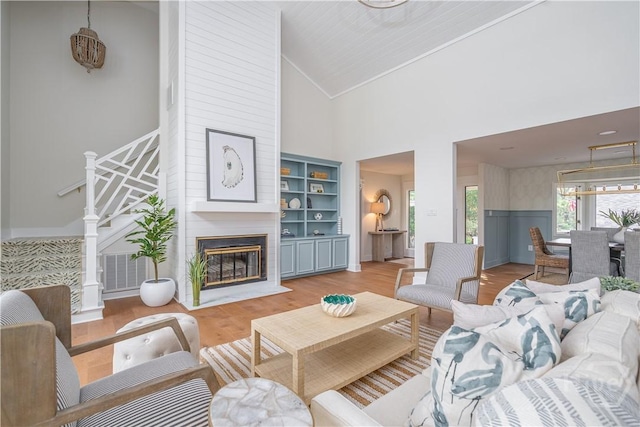 6 Schroeder Ct, Savannah, GA 31411 - living area featuring high vaulted ceiling, light wood-style floors, and a large fireplace