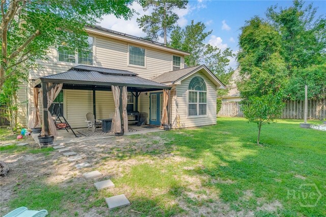 92 Shady Hill Cir, Richmond Hill, GA 31324 - back of house with a gazebo and a patio